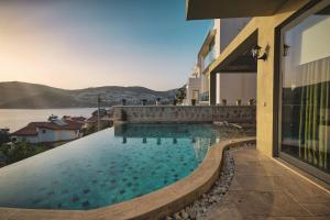 a swimming pool on the side of a building at Captivating Casa La Calypso in Kas