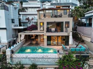an aerial view of a house with a swimming pool at Captivating Casa La Calypso in Kas
