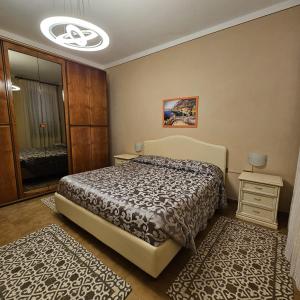 Letto o letti in una camera di Casa Luciana - Comfort a Lucca con Parcheggio