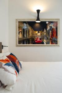 Postel nebo postele na pokoji v ubytování Dimora Del Vescovo Art Boutique Hotel