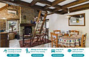 a kitchen and dining room with a table and chairs at Charmante maison en pierre - vue sur l'océan in Lilia