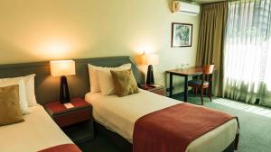 Postel nebo postele na pokoji v ubytování Hotel Eurotel El Bosque