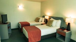 Postel nebo postele na pokoji v ubytování Hotel Eurotel El Bosque