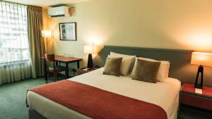 Postel nebo postele na pokoji v ubytování Hotel Eurotel El Bosque