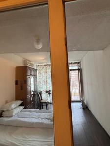 Ένα ή περισσότερα κρεβάτια σε δωμάτιο στο Ritz