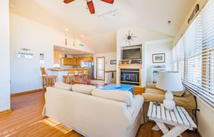 a living room with a couch and a fireplace at Casa Bonita in Corolla