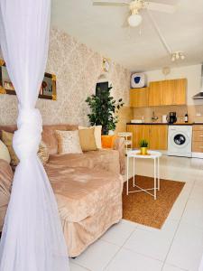 a living room with a couch and a table at Atlantic Ocean & Beach Views - Playa Del Cura in Las Palmas de Gran Canaria