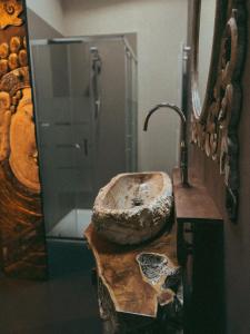 a bathroom with a sink and a glass shower at Il Fienile B&B in Guastalla