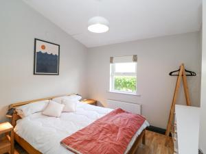 Una cama o camas en una habitación de The Sleepy Shell