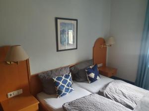 Postel nebo postele na pokoji v ubytování Gasthaus Krone