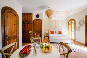 a room with a bed and a table with fruit on it at The Lemon Garden Villa by Elite Villas in Pontone +31 photos