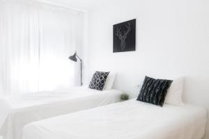 Posteľ alebo postele v izbe v ubytovaní Soho Riverside Suite Málaga