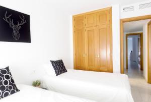 Posteľ alebo postele v izbe v ubytovaní Soho Riverside Suite Málaga