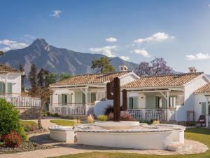a house with a cactus in the front yard at Boho Club in Marbella