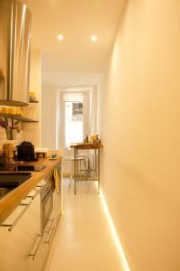 a kitchen with a counter and a table in it at La Chicca di Sant'Agata in Brescia