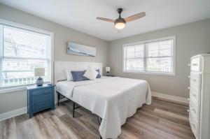 a bedroom with a bed and a ceiling fan at Surf Shore Properties in North Wildwood