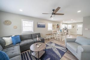 a living room with a couch and a table at Surf Shore Properties in North Wildwood