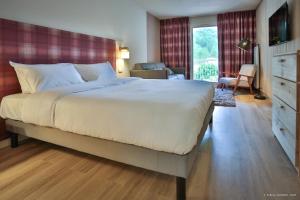 Postel nebo postele na pokoji v ubytování Hôtel Le Refuge des Sources