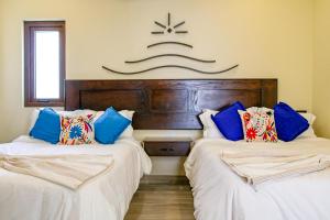 Ένα ή περισσότερα κρεβάτια σε δωμάτιο στο Paz del Mar Room 01 Paloma +14 φωτογραφίες