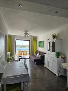 a living room with a couch and a table at Carabela in Port d'Alcudia
