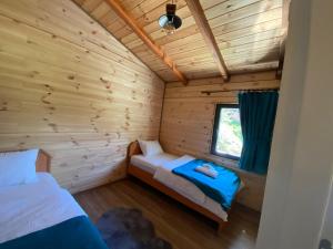 Postel nebo postele na pokoji v ubytování NİKA