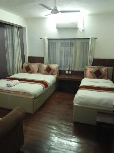 Postel nebo postele na pokoji v ubytování Grape Apartment