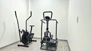 two exercise bikes are sitting in a room at Hotel Ktaleya Apartamentos in Bogotá