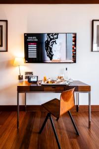 a desk with a plate of food on top of it at Grand Hôtel Champs-Elysées in Paris