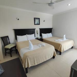 Postel nebo postele na pokoji v ubytování Hotel CEO Group + 37 fotografií