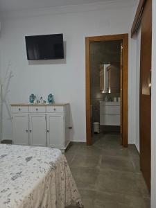 Μια τηλεόραση ή/και κέντρο ψυχαγωγίας στο Apartamento AGUA AZUL