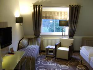 Postel nebo postele na pokoji v ubytování NordWest-Hotel Bad Zwischenahn