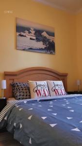 a bedroom with a bed with pillows on it at Cozy Suite #1 in the Heart of DT Quebec with QB in Quebec City