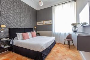 Postel nebo postele na pokoji v ubytování Hotel Parrasio + 37 fotografií