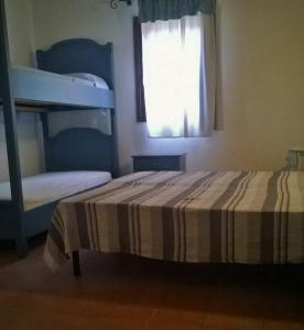 En eller flere senge i et værelse på villa Giusy