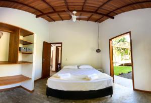 Ένα ή περισσότερα κρεβάτια σε δωμάτιο στο Casas de temporada