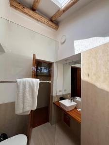 a bathroom with a sink and a mirror at Luxury house in Urubamba, Cusco, Perú in Urubamba