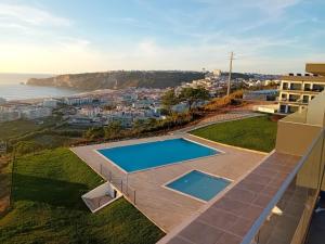 an aerial view of a house with a swimming pool at Afrodite Styling Penthouse in Nazaré