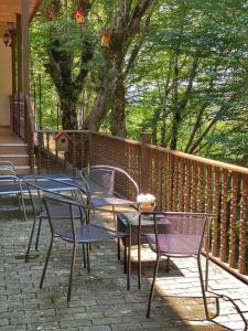 a group of tables and chairs on a patio at Soisha in Jvari