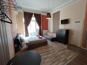 Televízia a/alebo spoločenská miestnosť v ubytovaní Liechtenstein Apartments