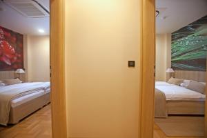 Postel nebo postele na pokoji v ubytování Hotel Calypso