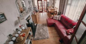 an aerial view of a living room with a red couch at Drumhirk House in Newtownards