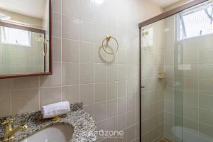 a bathroom with a shower and a sink at Apto 3Q c/ varanda a 100m da Praia em BC EVZ0601 in Balneário Camboriú +14 photos