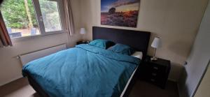 Postel nebo postele na pokoji v ubytování Boshuis de Roerdomp
