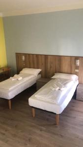 Postel nebo postele na pokoji v ubytování Hotel Garden