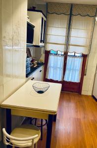 a kitchen with a table with a bowl on it at Casona Mayor in Andorra