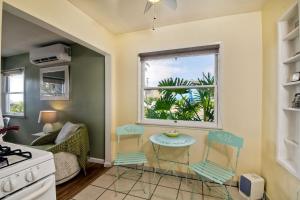 a kitchen with a window and a table and chairs at 167 Tamarack in Carlsbad