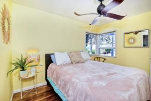 a bedroom with a bed and a ceiling fan at 167 Tamarack in Carlsbad +20 photos