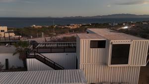 a white building with a view of the water at 20-30 Knots in El Sargento