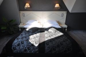 Łóżko lub łóżka w pokoju w obiekcie Hotel Wawel