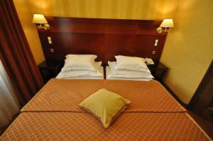 Łóżko lub łóżka w pokoju w obiekcie Hotel Wawel